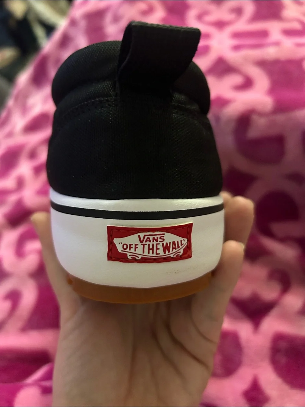 Vans Black Slip-On Sneakers with White Midsole and Gum Outsole